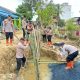 Brimob Polda Sumut Bersama Masyarakat Perbaiki